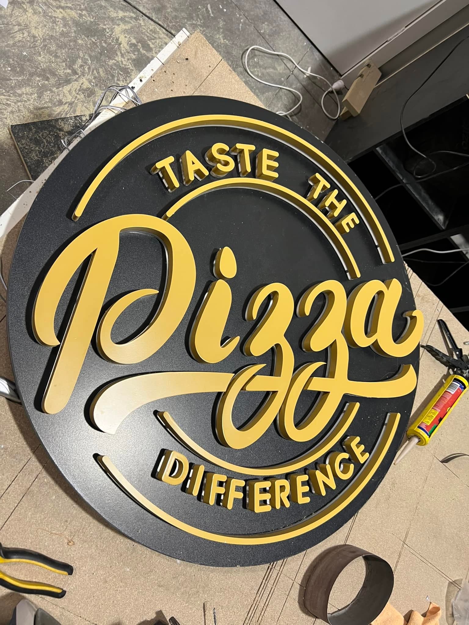 Illuminated shopfront sign installed
