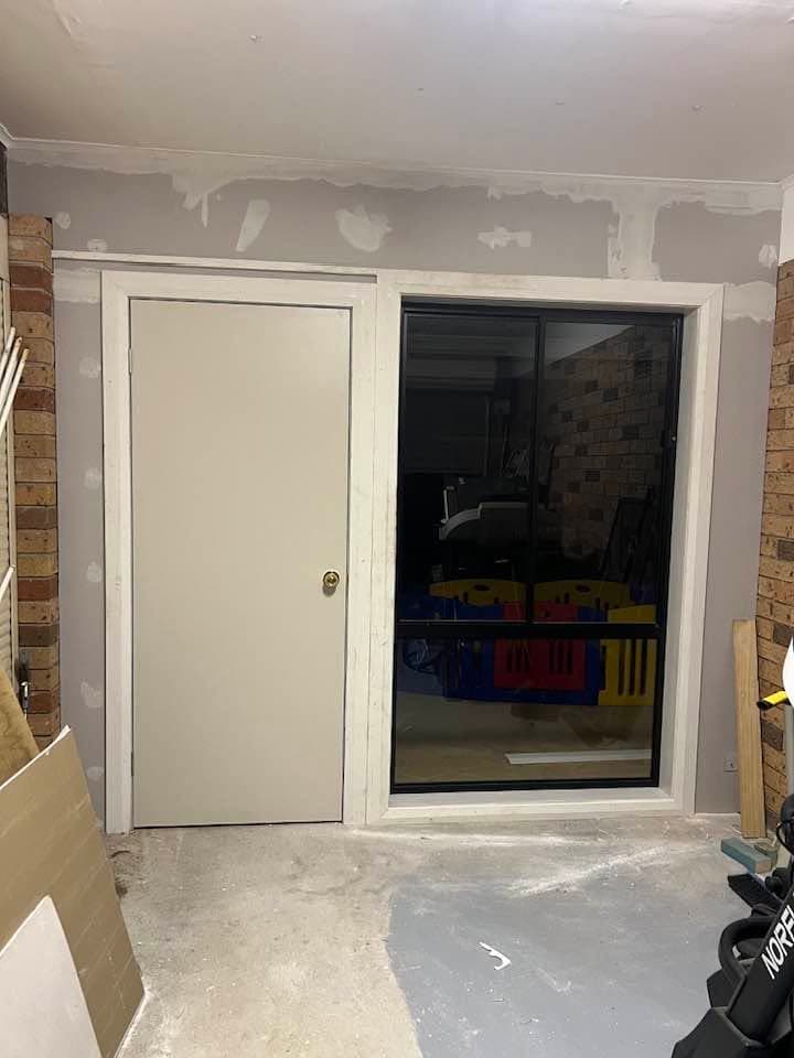 New internal wall with a door and window opening