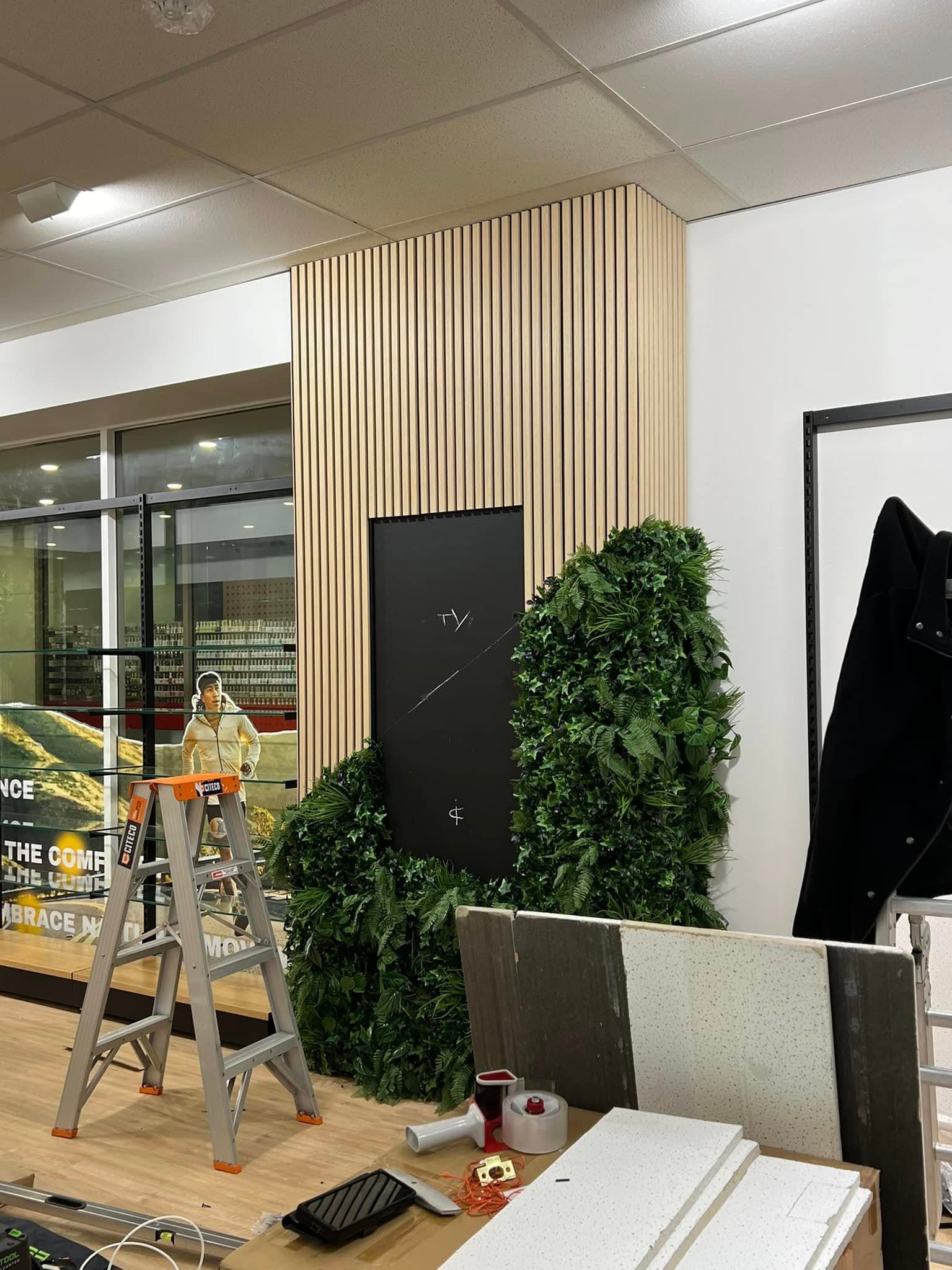 Timber slat feature wall going up in a shop fitout